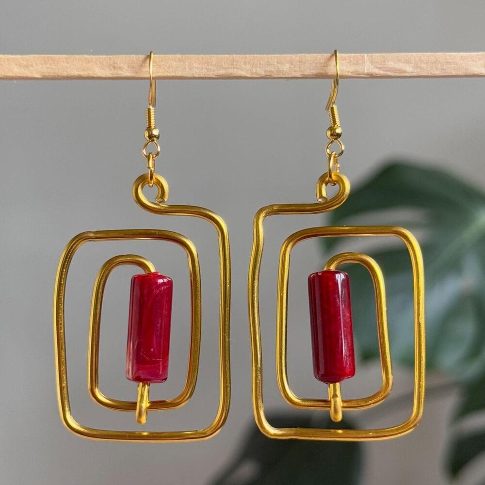handmade gold wire spiral earrings with crimson red colored tube beads